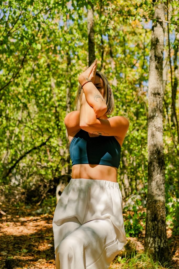 Woman doing yoga in the forest of GEA Retreat Montenegro